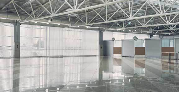 This image shows a commercial space with white gray epoxy floor.