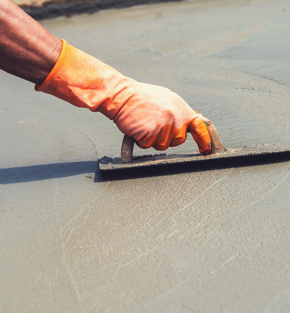 This image shows a man resurfacing a cement floor.