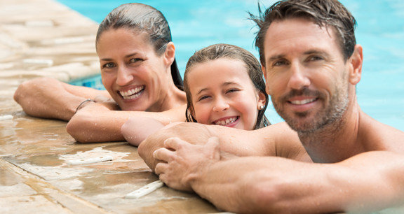 This image shows a family smiling.