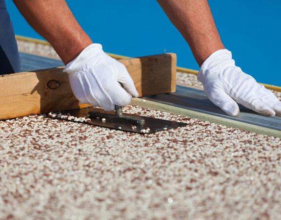 This image shows a pool deck being resurfaced.