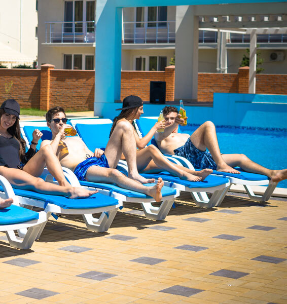 This image shows a group of people enjoying at the pool deck.