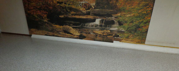 This image shows a Basement Floor with flake epoxy paint.